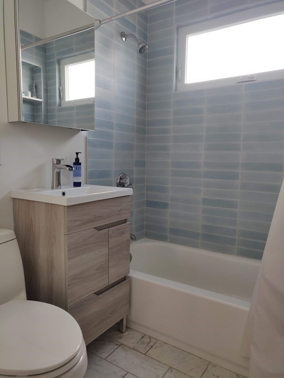 7 Gorham Road Medford, MA 02155 - Photo 30 of 42 a bathroom with a sink a toilet and shower