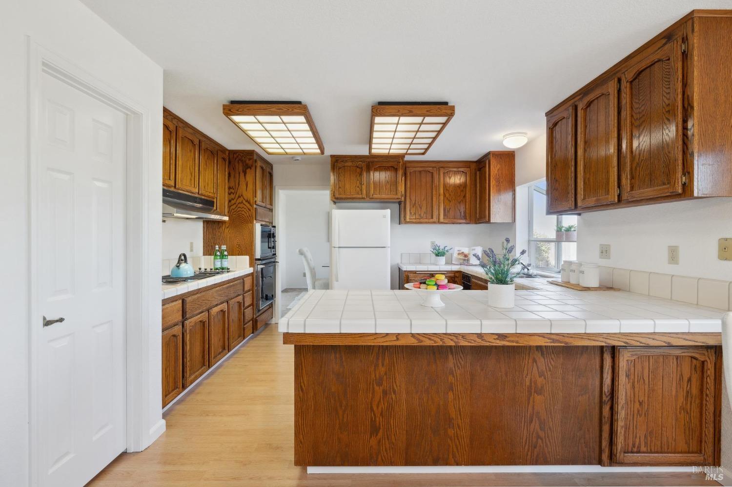284 Preakness Lane Vallejo, CA 94591 - Photo 12 of 62 a kitchen with stainless steel appliances granite countertop a sink dishwasher stove and oven