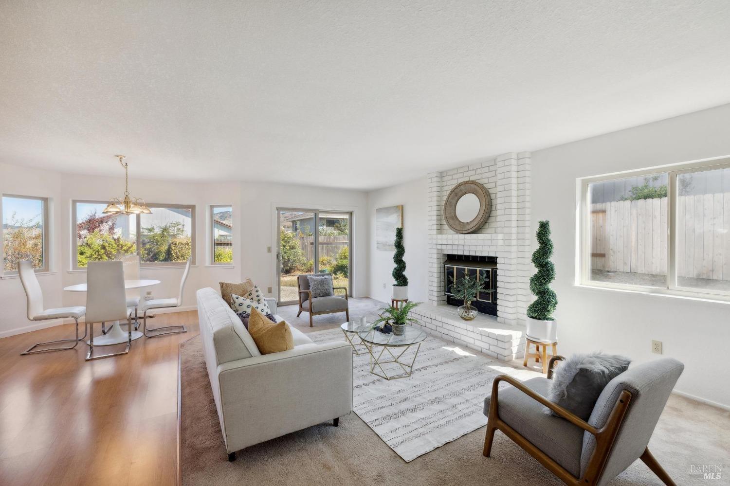 284 Preakness Lane Vallejo, CA 94591 - Photo 20 of 62 a living room with furniture a fireplace and a large window with balcony view