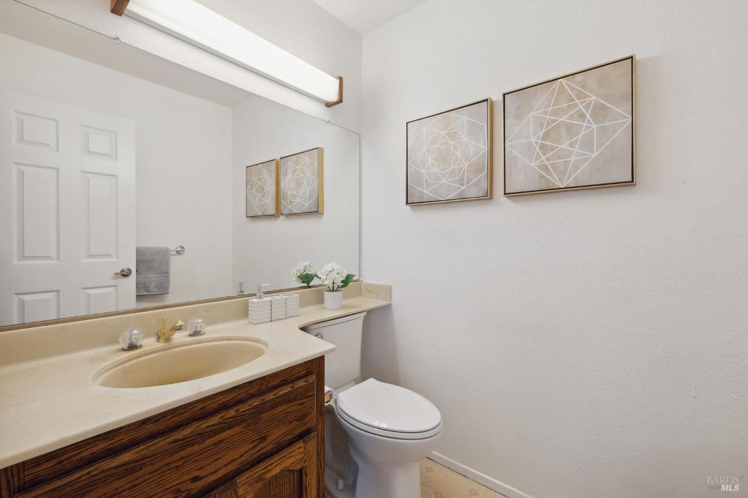 284 Preakness Lane Vallejo, CA 94591 - Photo 25 of 62 a bathroom with a sink toilet and mirror