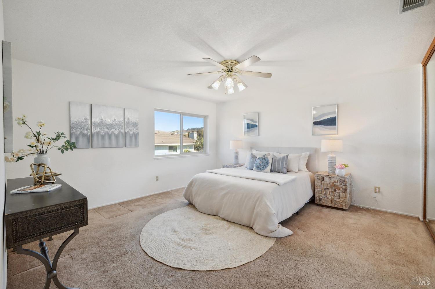 284 Preakness Lane Vallejo, CA 94591 - Photo 36 of 62 a spacious bedroom with a bed and a chair