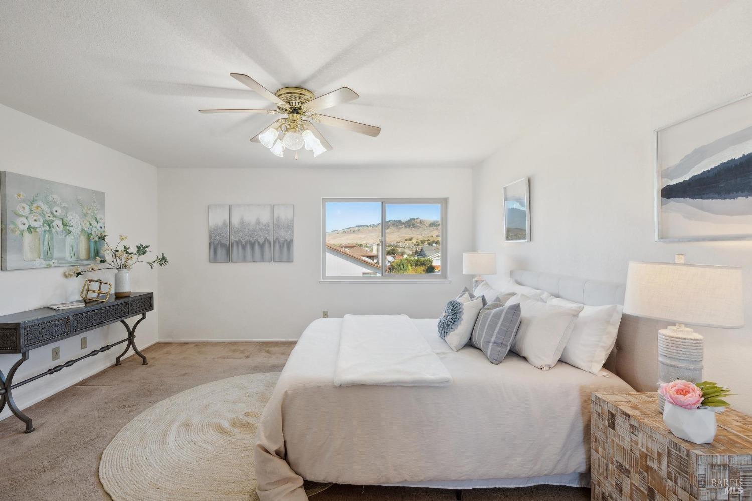 284 Preakness Lane Vallejo, CA 94591 - Photo 37 of 62 a bedroom with a bed and a chandelier