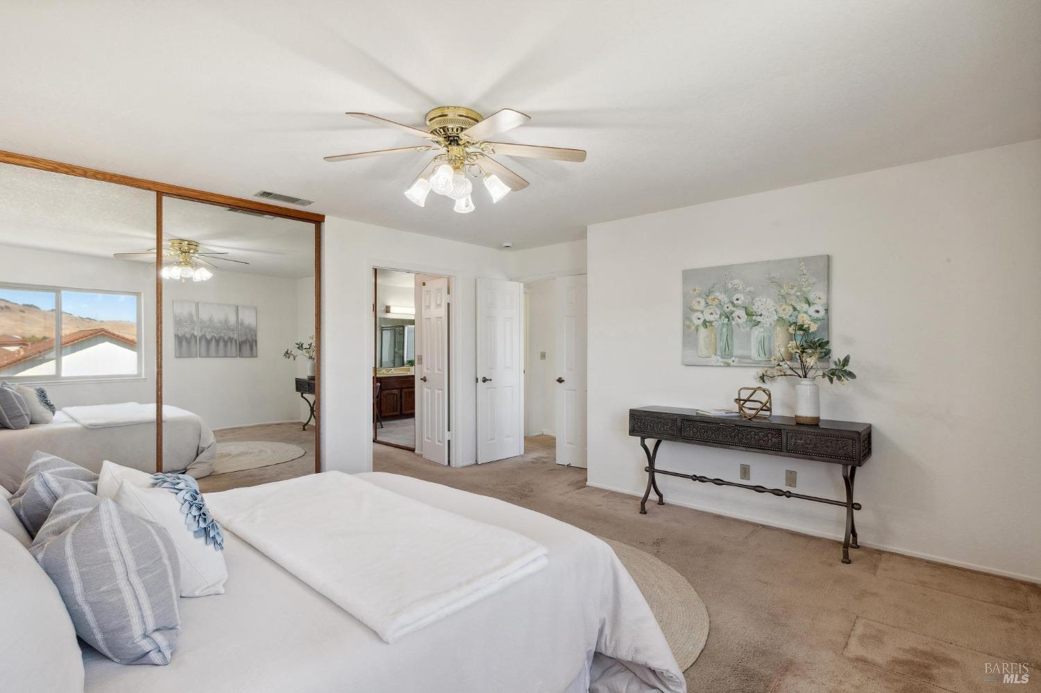 284 Preakness Lane Vallejo, CA 94591 - Photo 40 of 62 a bedroom with a bed and a chandelier