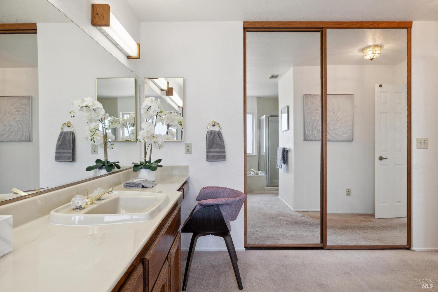 284 Preakness Lane Vallejo, CA 94591 - Photo 43 of 62 a en suite bathroom with a granite countertop sink and a mirror