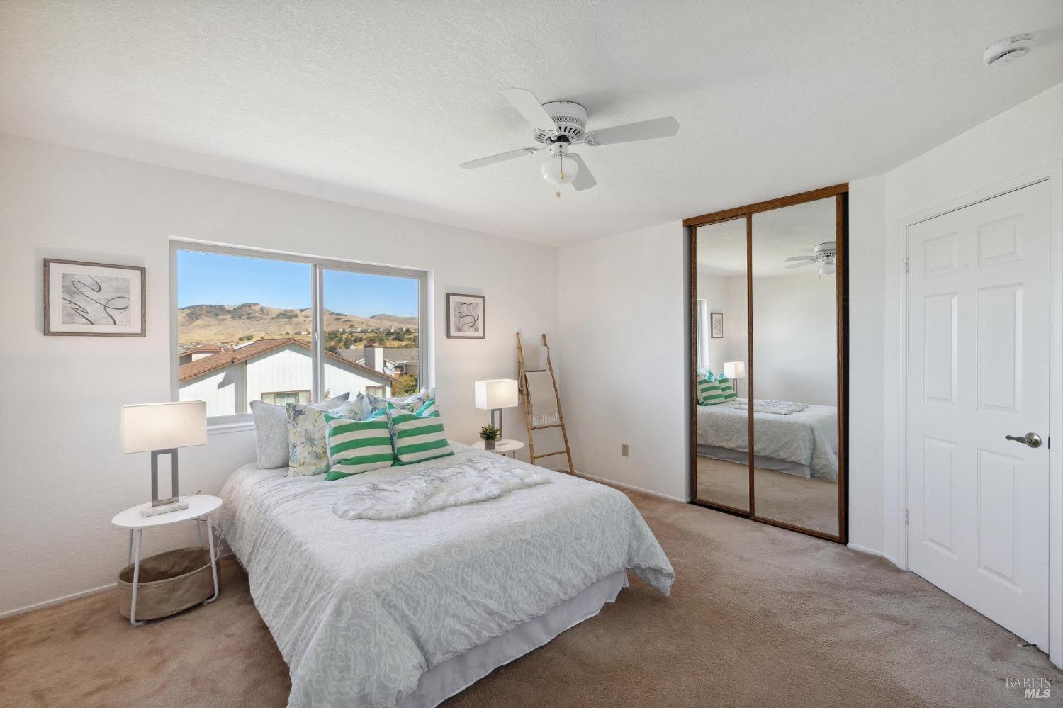 284 Preakness Lane Vallejo, CA 94591 - Photo 47 of 62 a bedroom with a bed and a chandelier