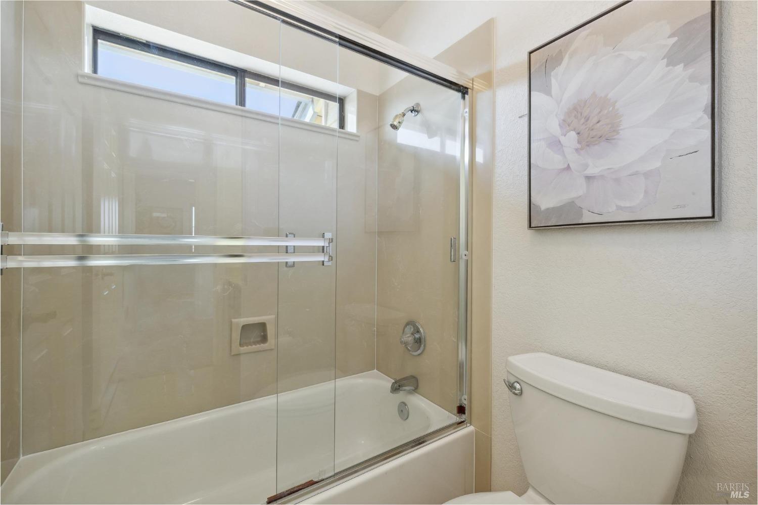 284 Preakness Lane Vallejo, CA 94591 - Photo 57 of 62 a bathroom with a shower and a toilet