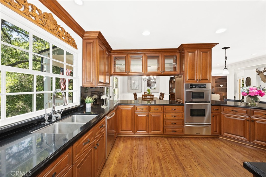 8 Hidden Valley Road Monrovia, CA 91016 - Photo 17 of 45 a kitchen with stainless steel appliances granite countertop a stove a sink and a refrigerator