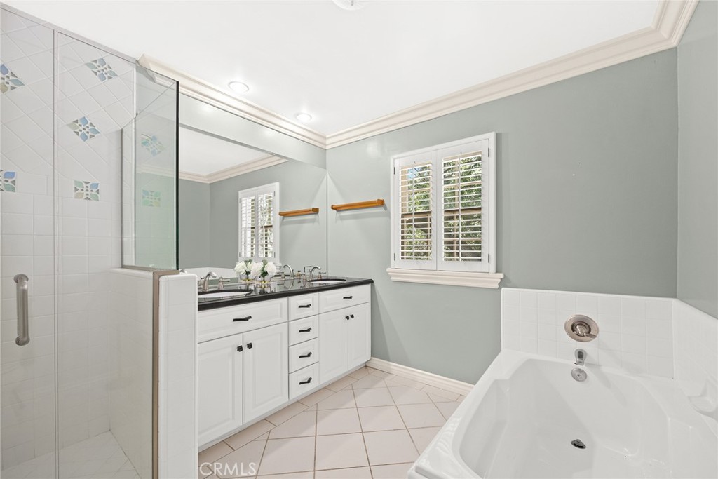 8 Hidden Valley Road Monrovia, CA 91016 - Photo 25 of 45 a bathroom with a bathtub sink and mirror