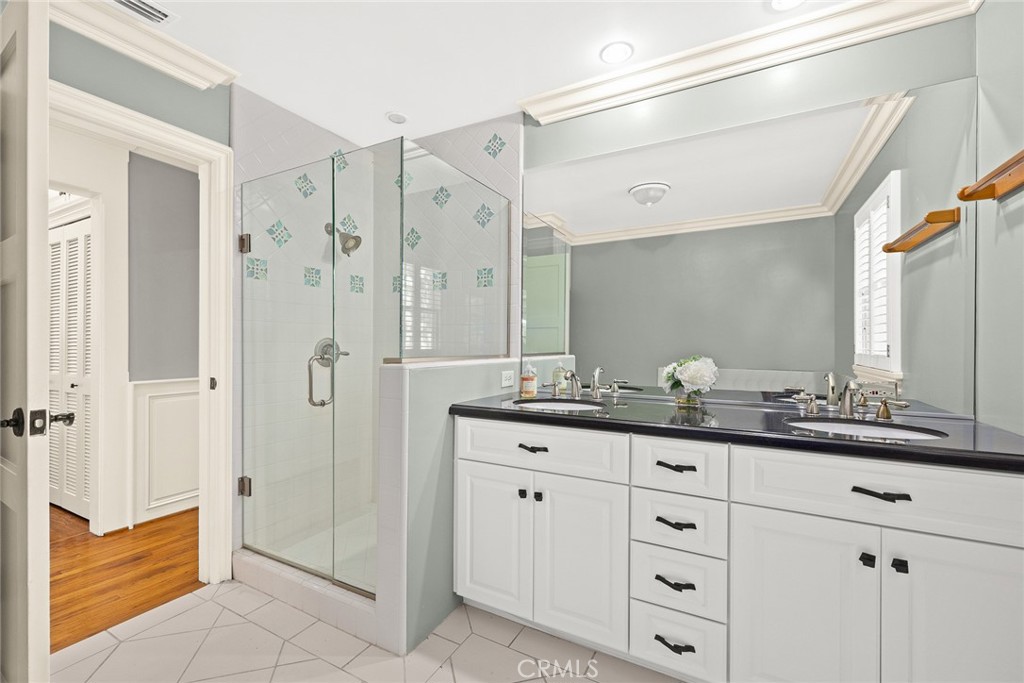 8 Hidden Valley Road Monrovia, CA 91016 - Photo 26 of 45 a bathroom with a granite countertop sink mirror and shower