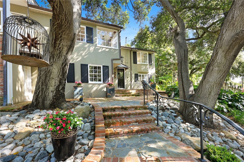 8 Hidden Valley Road Monrovia, CA 91016 - Photo 4 of 45 a front view of a house with a garden