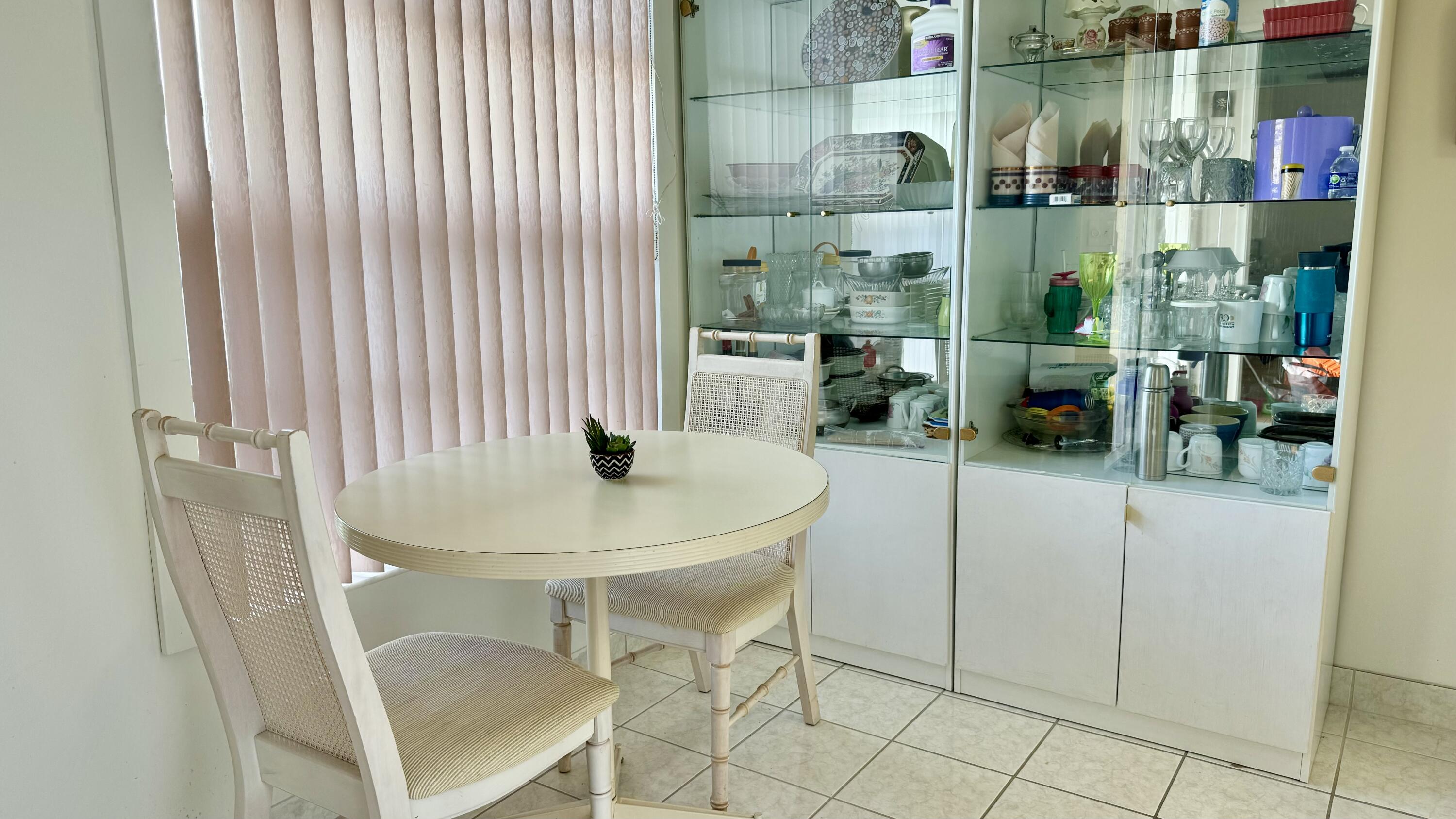 1551 Northwest 20th Avenue, Unit 102 Delray Beach, FL 33445 - Photo 18 of 18 a view of a room with gym equipment