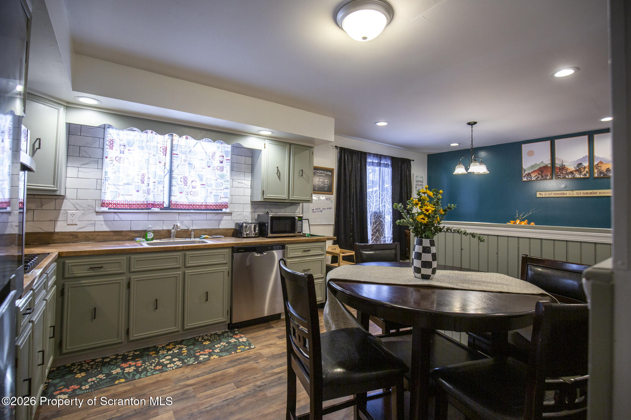 544 Sullivan Trail Long Pond, PA 18334 - Photo 14 of 68 a kitchen with a dining table chairs and microwave