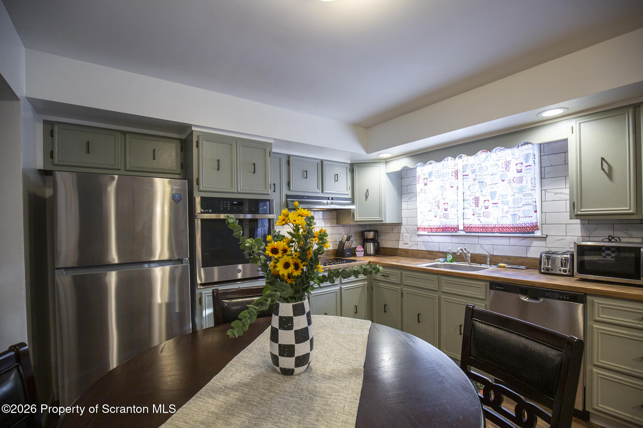 544 Sullivan Trail Long Pond, PA 18334 - Photo 18 of 68 a kitchen with stainless steel appliances granite countertop a refrigerator and a sink
