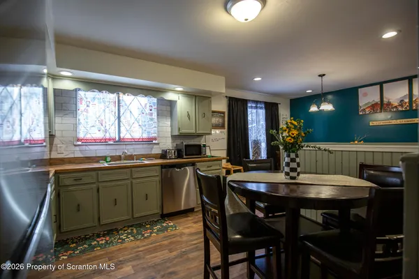 a room with wooden floor and furniture