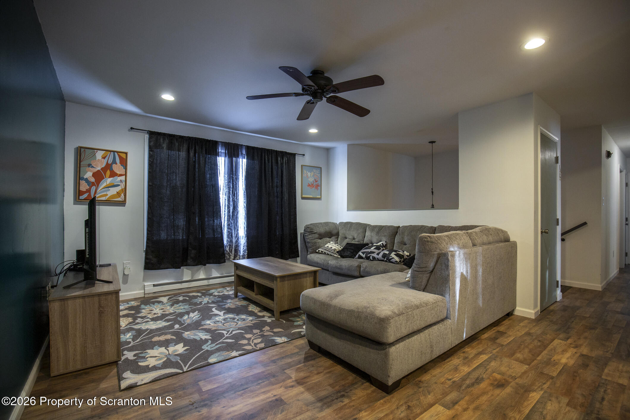 544 Sullivan Trail Long Pond, PA 18334 - Photo 29 of 68 a living room with furniture and a flat screen tv