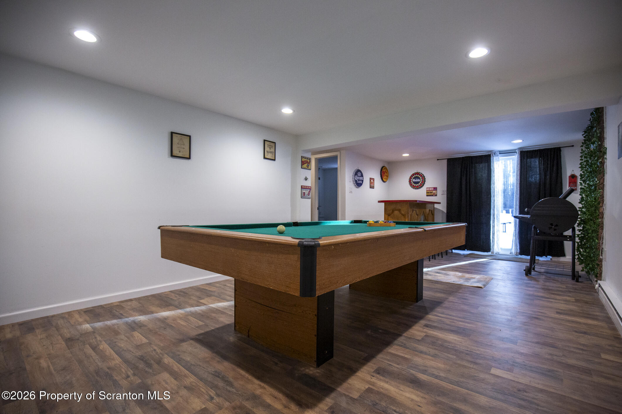 544 Sullivan Trail Long Pond, PA 18334 - Photo 32 of 68 a room with wooden floor and furniture