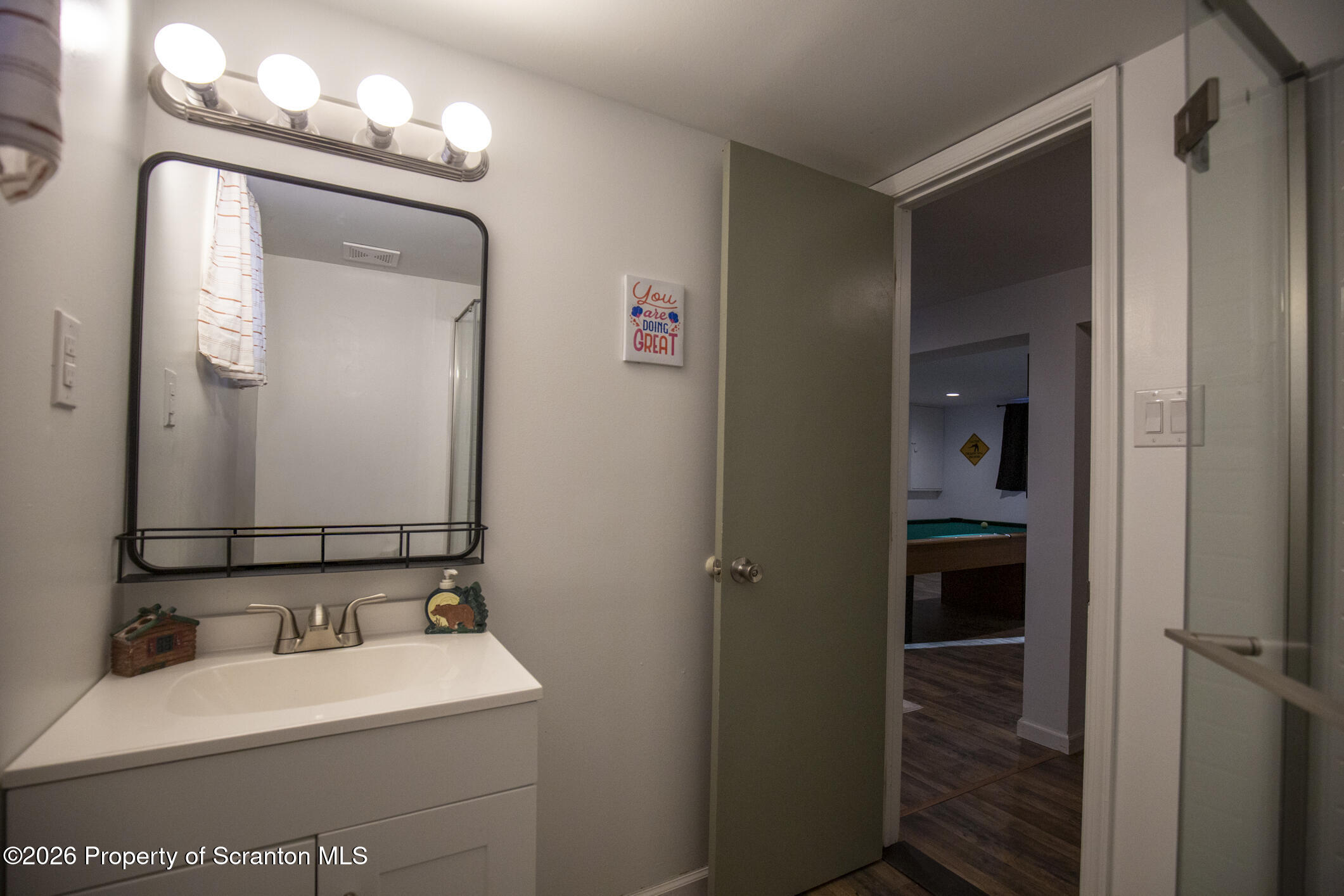 544 Sullivan Trail Long Pond, PA 18334 - Photo 39 of 68 a bathroom with a sink a toilet and mirror