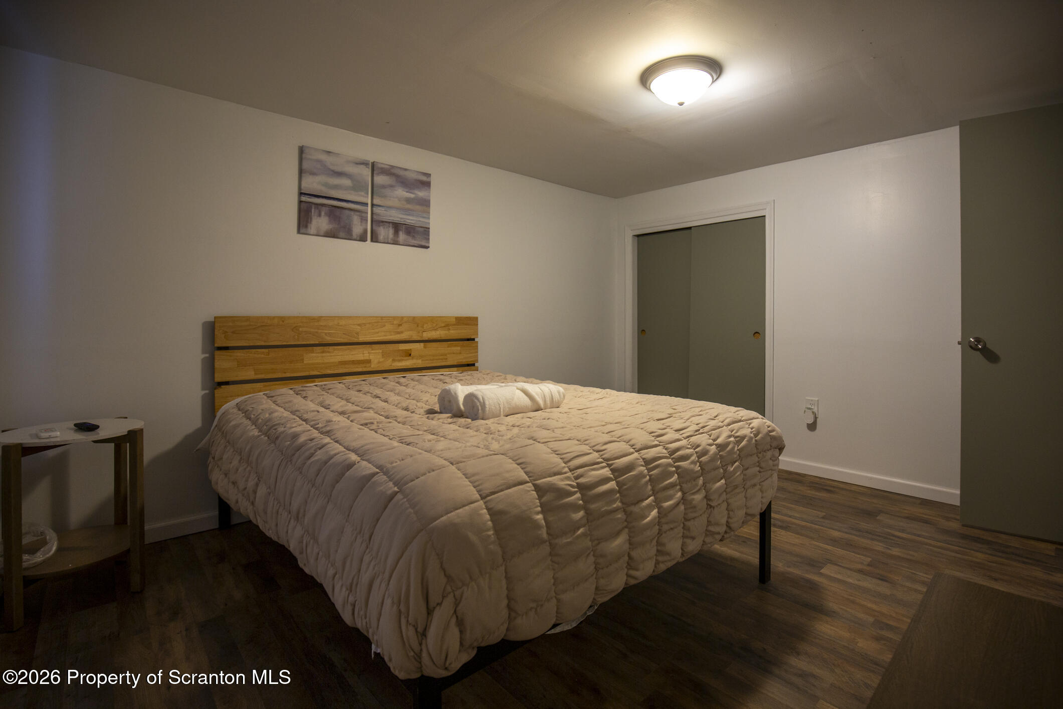 544 Sullivan Trail Long Pond, PA 18334 - Photo 51 of 68 a bedroom with a bed and wooden floor