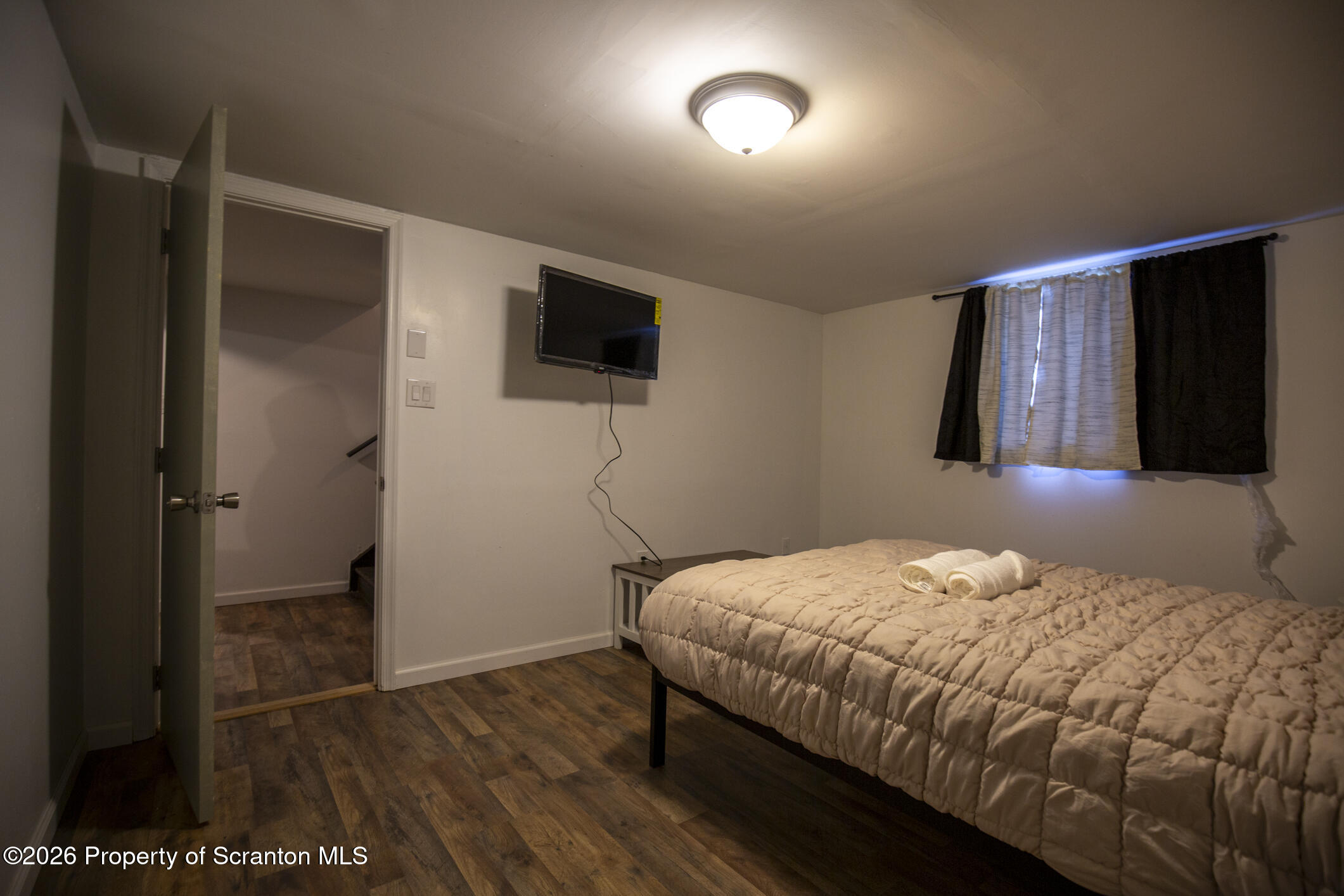 544 Sullivan Trail Long Pond, PA 18334 - Photo 52 of 68 a bedroom with a bed and a flat screen tv