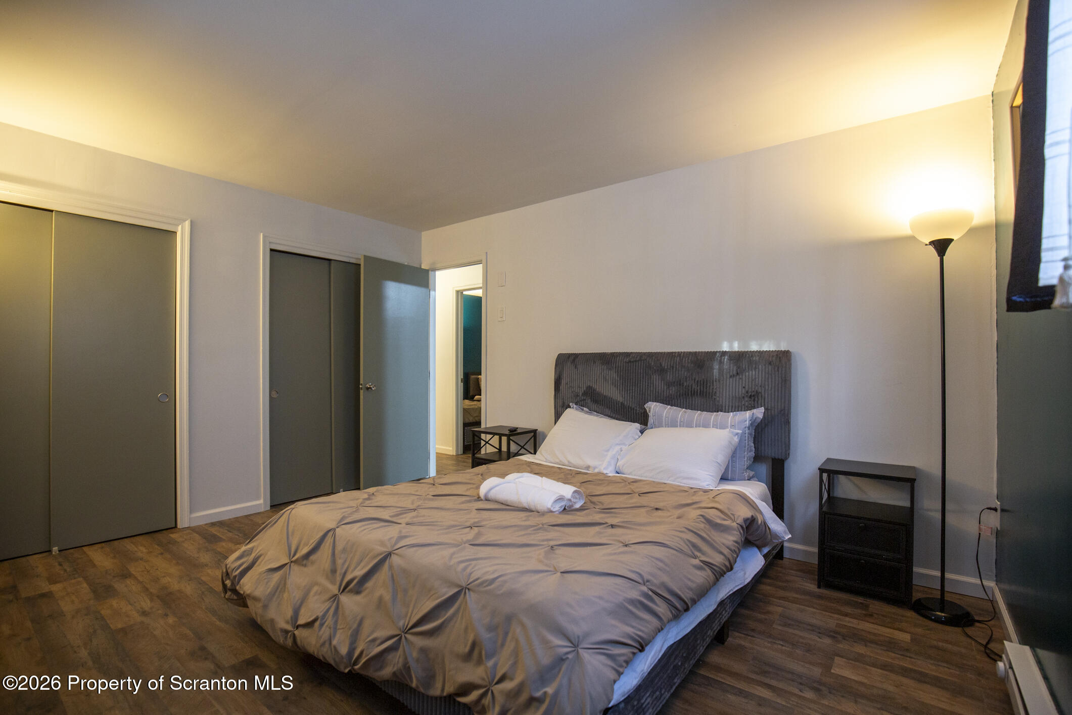 544 Sullivan Trail Long Pond, PA 18334 - Photo 61 of 68 a bedroom with a bed and wooden floor