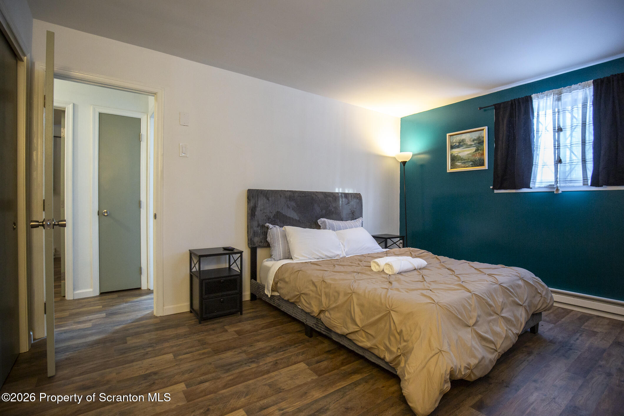 544 Sullivan Trail Long Pond, PA 18334 - Photo 62 of 68 a bedroom with a bed and wooden floor