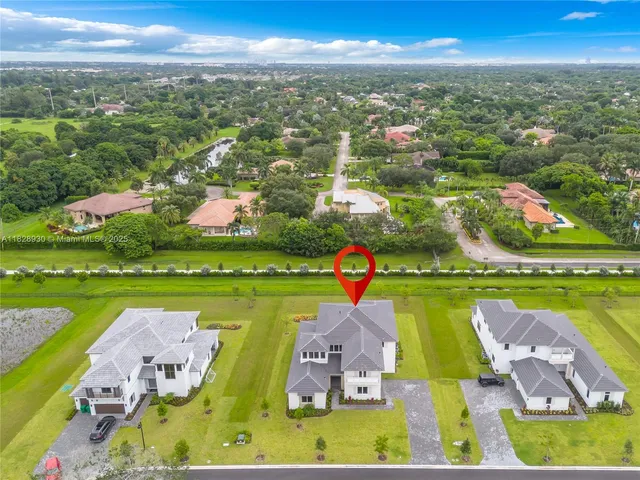 an aerial view of an ocean and city
