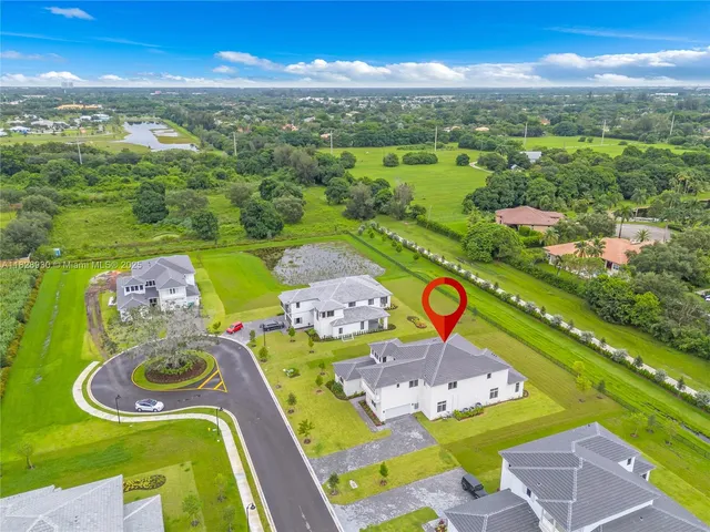 a view of an entryway of a room with windows