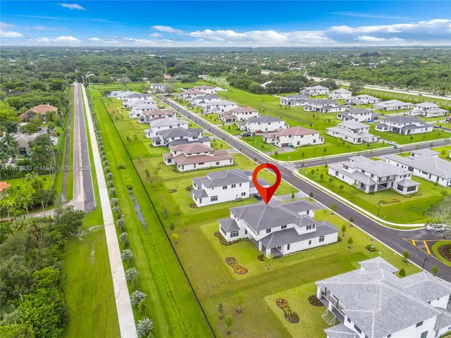 a view of an empty room with wooden fence