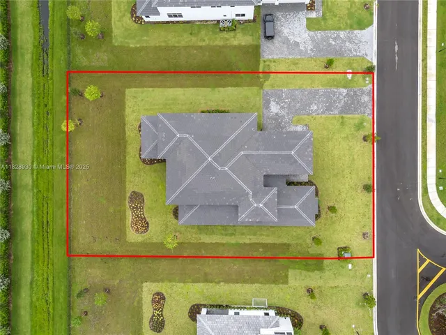 a large kitchen with stainless steel appliances a large counter top a stove and a sink