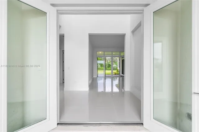 a kitchen with stainless steel appliances a sink stove and cabinets