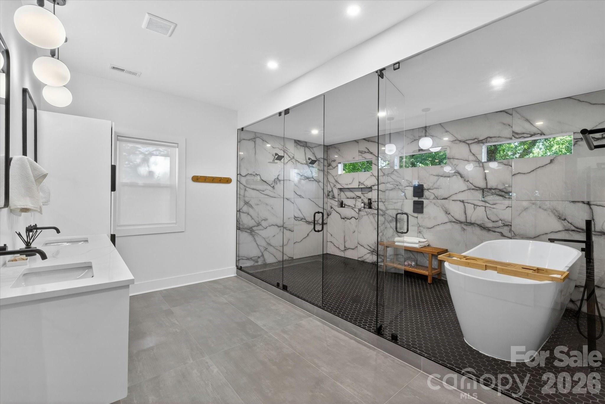 1608 Chippendale Road Charlotte, NC 28205 - Photo 35 of 46 a bathroom with a bathtub and toilet