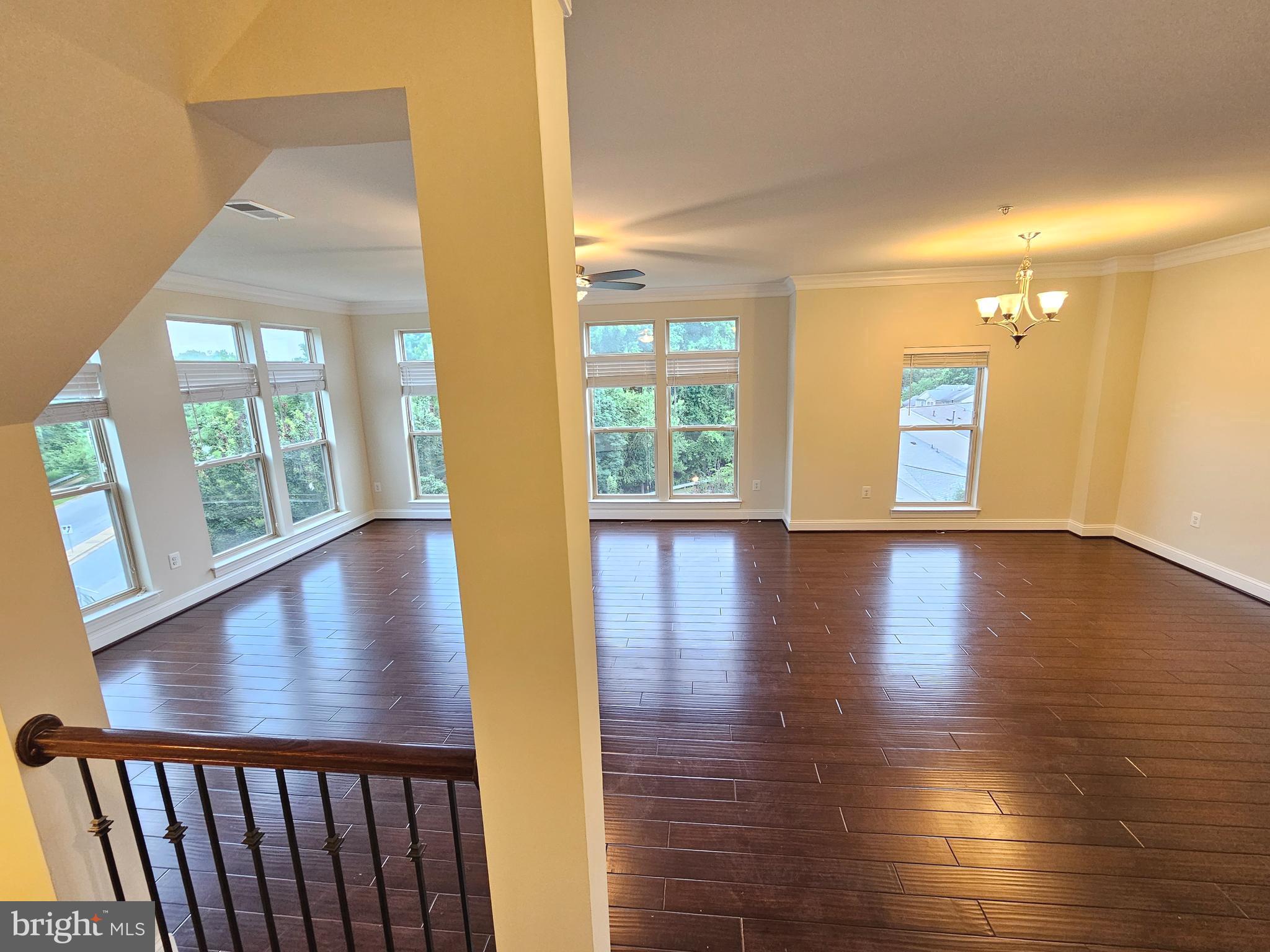 164 Copley Circle, Unit 27B Gaithersburg, MD 20878 - Photo 14 of 34 an empty room with wooden floor and windows