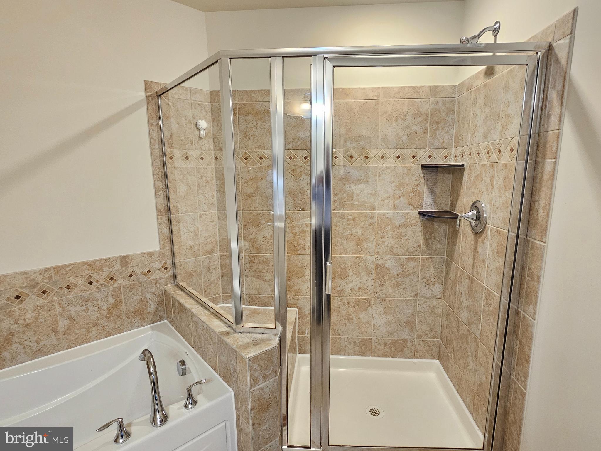 164 Copley Circle, Unit 27B Gaithersburg, MD 20878 - Photo 22 of 34 a bathroom with a bathtub and a shower