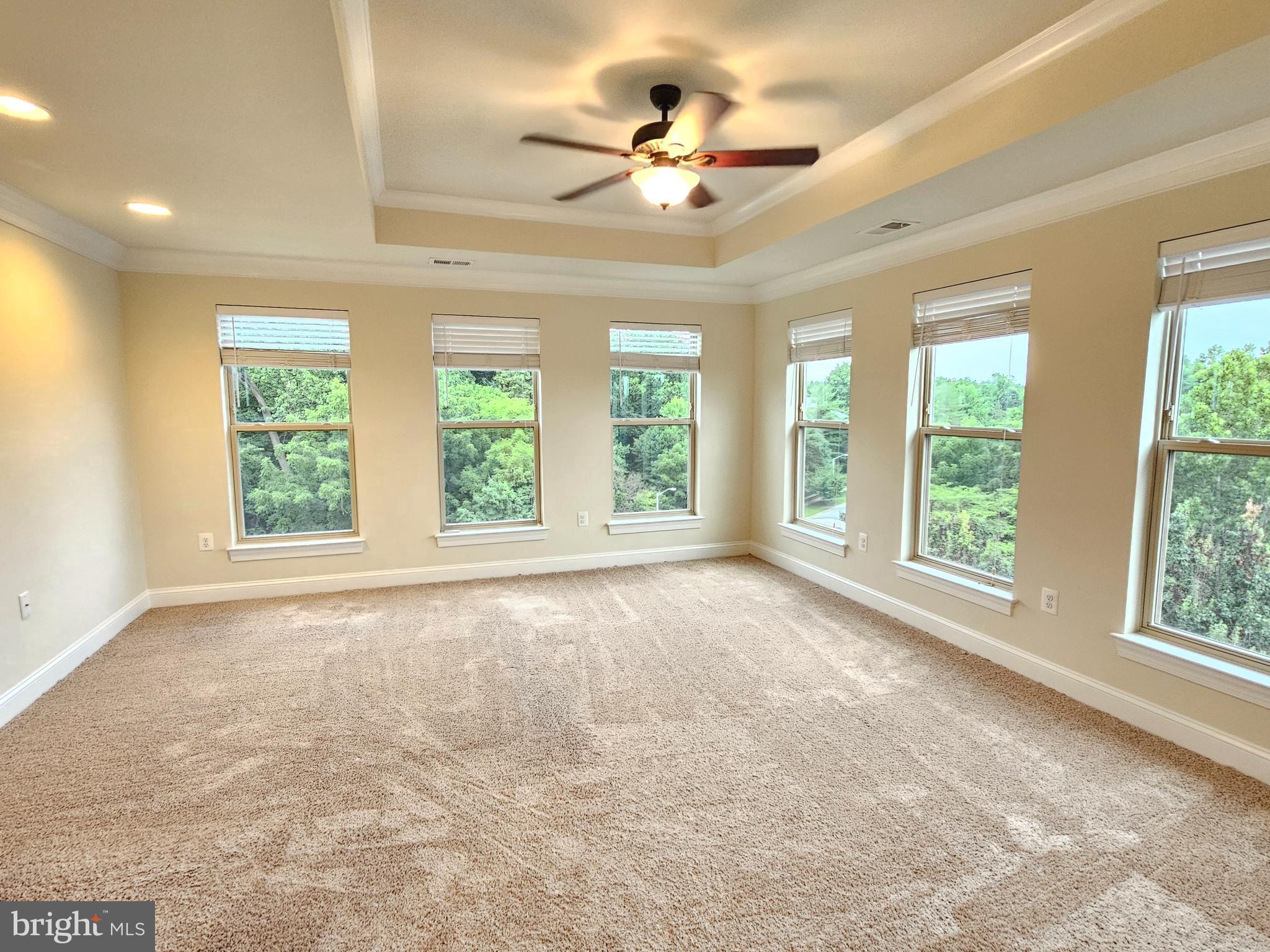 164 Copley Circle, Unit 27B Gaithersburg, MD 20878 - Photo 23 of 34 a view of an empty room with a window