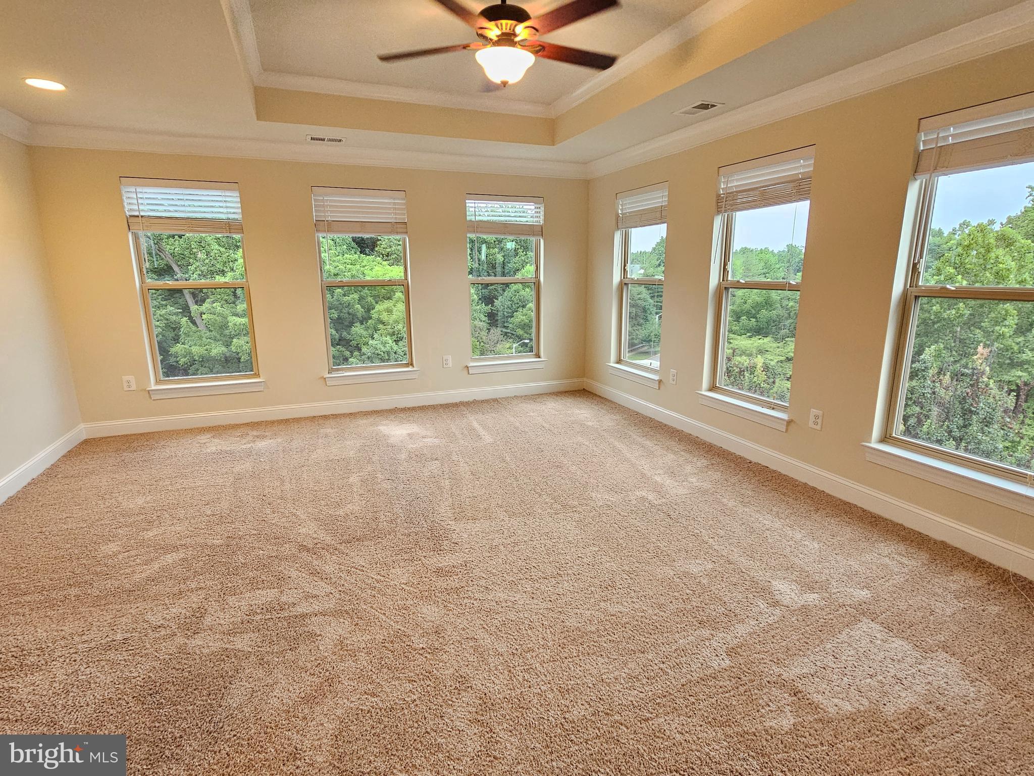 164 Copley Circle, Unit 27B Gaithersburg, MD 20878 - Photo 25 of 34 a view of an empty room with a window