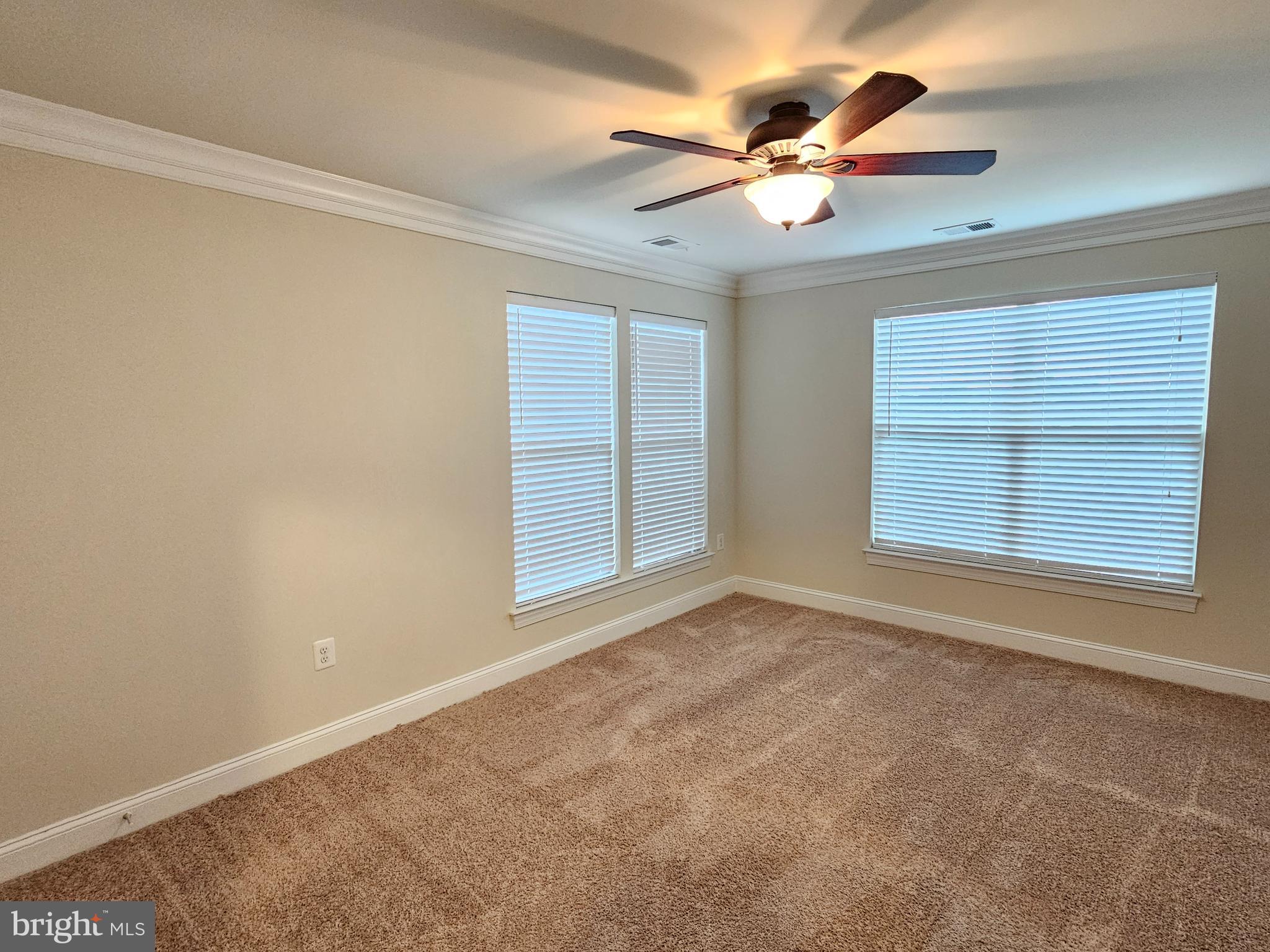 164 Copley Circle, Unit 27B Gaithersburg, MD 20878 - Photo 26 of 34 a view of an empty room with a window