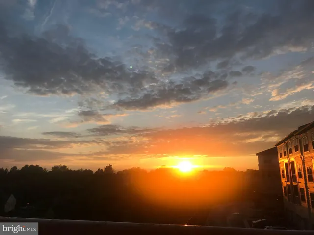 a view of car parked on the roadside