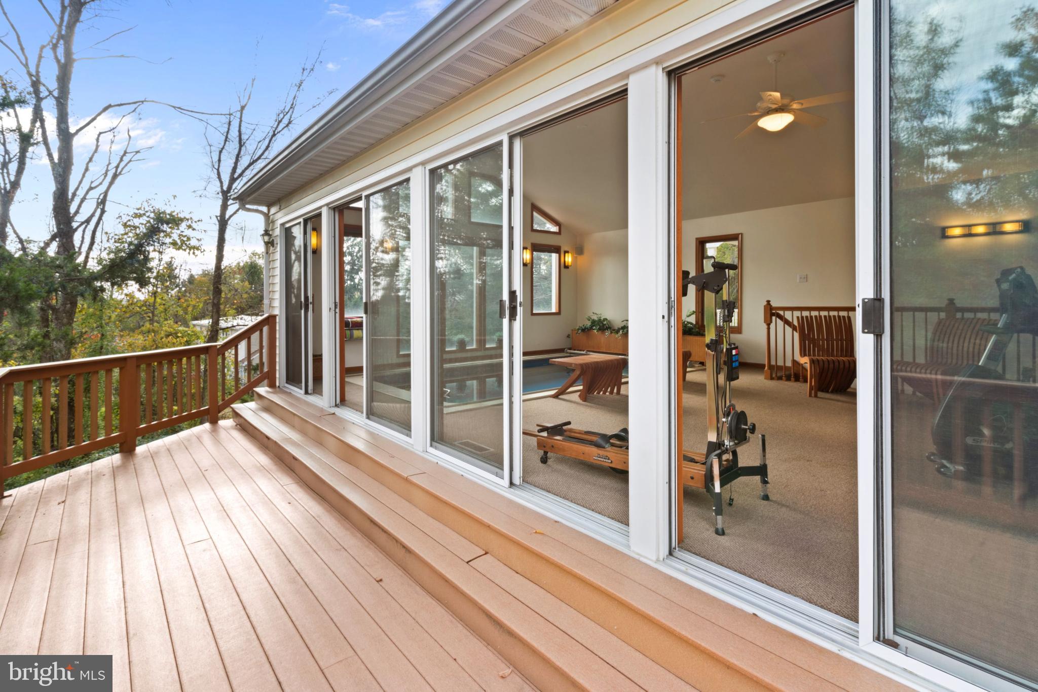 393 Township Line Road Chalfont, PA 18914 - Photo 43 of 56 Expansive glass doors from swim area