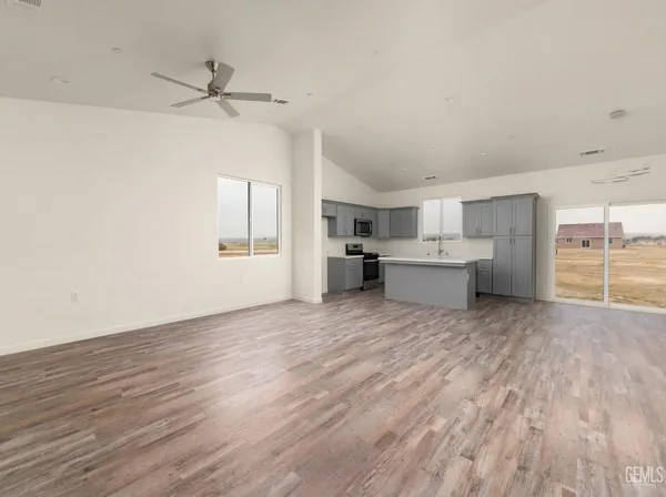 a view of a room with wooden floor