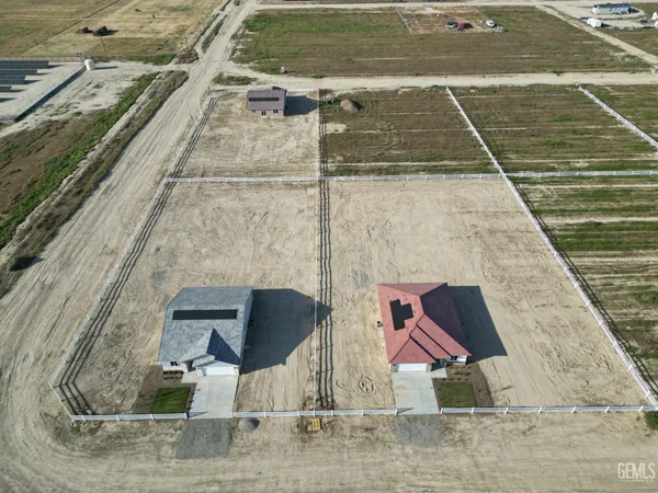 a aerial view of a house with a yard