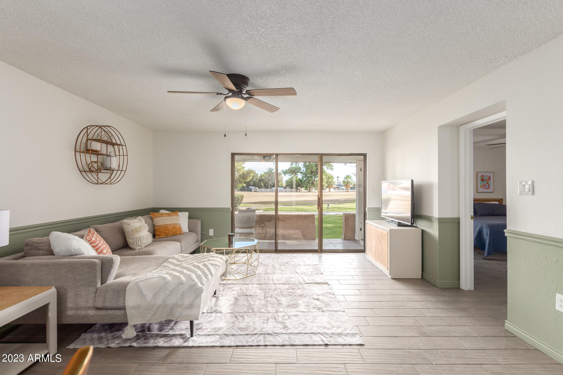 709 South Power Road, Unit 105 Mesa, AZ 85206 - Photo 1 of 36 a bedroom with furniture and large windows