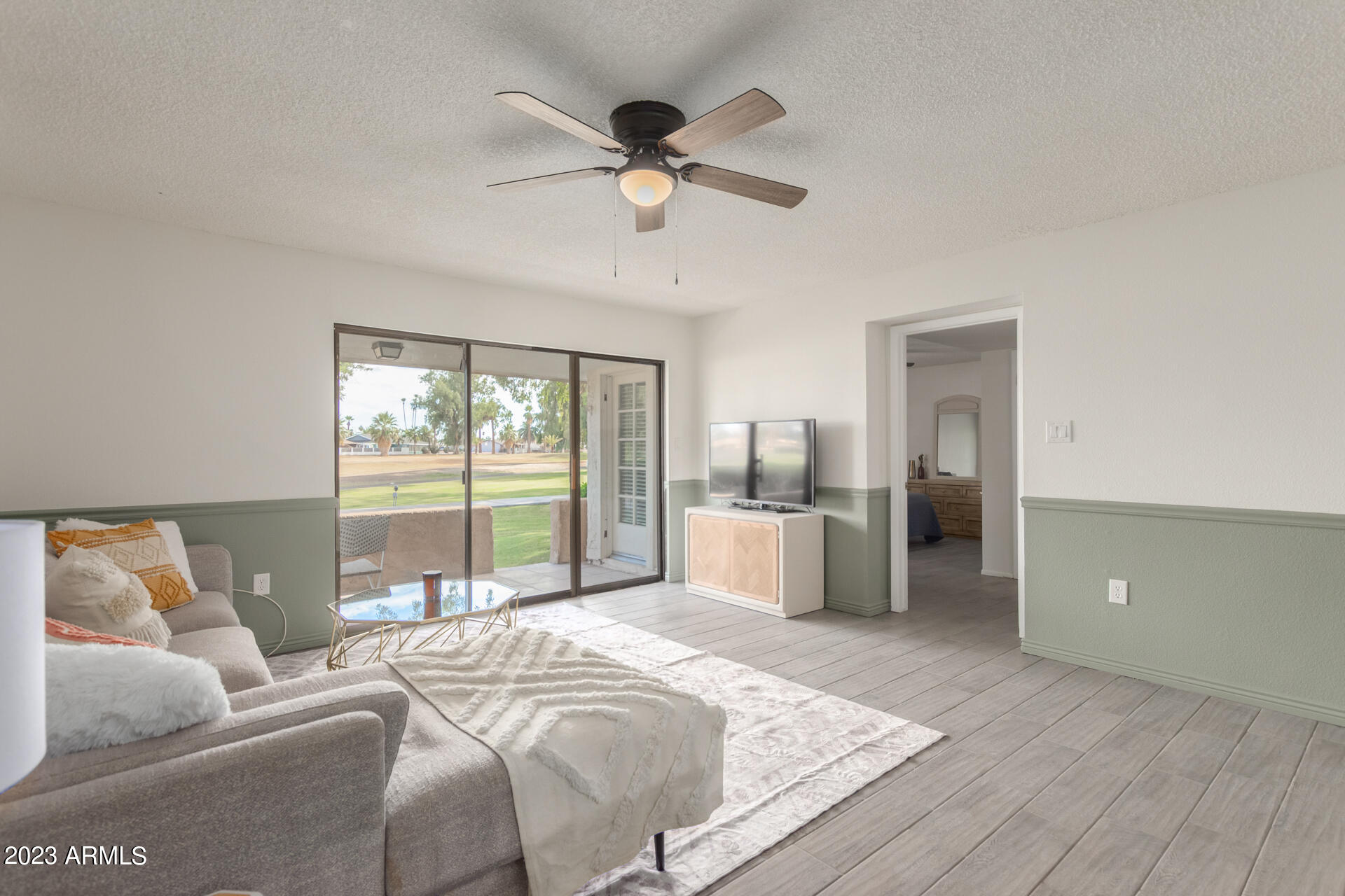 709 South Power Road, Unit 105 Mesa, AZ 85206 - Photo 2 of 36 a bed room with a bed and a large window