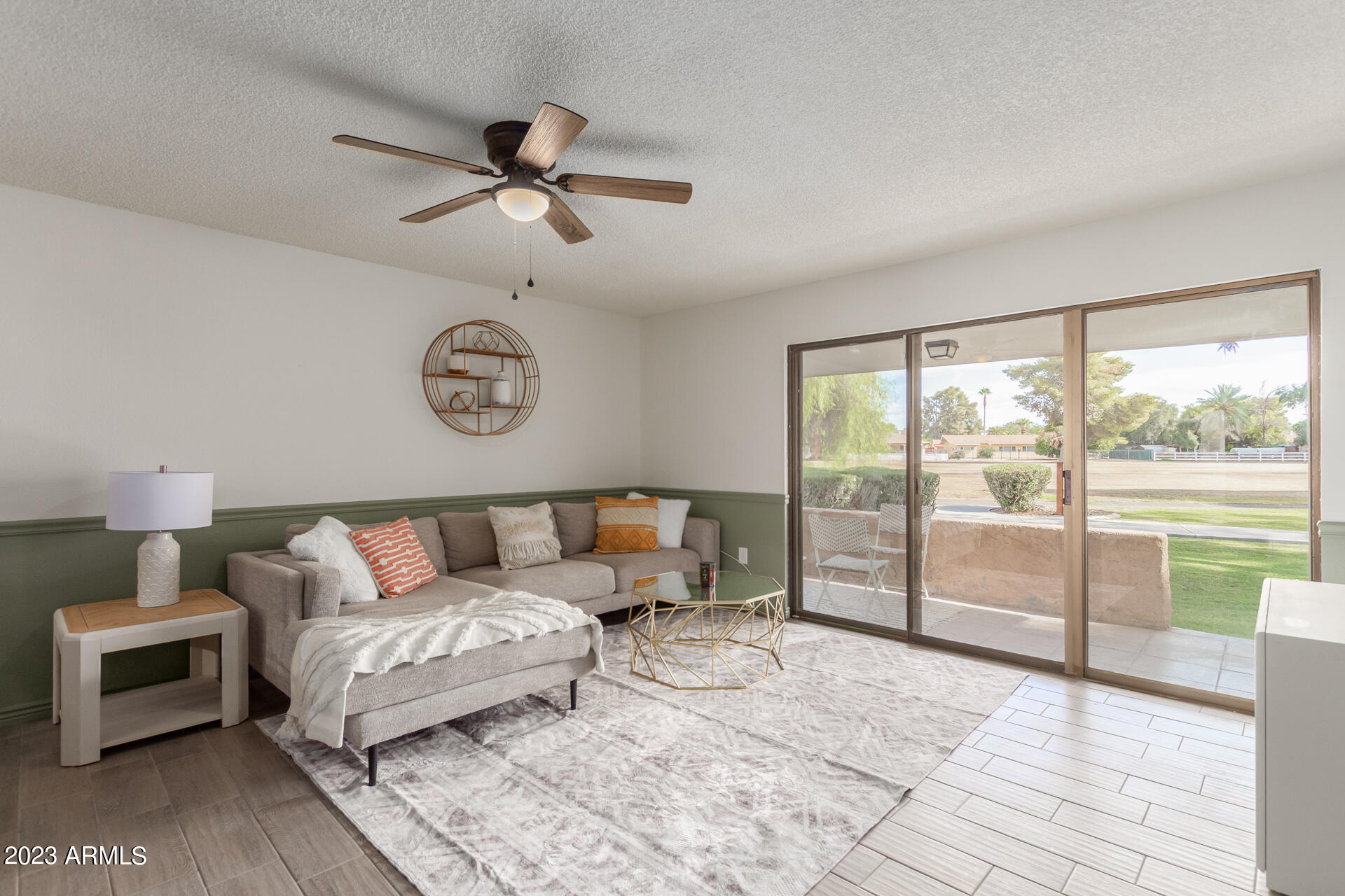 709 South Power Road, Unit 105 Mesa, AZ 85206 - Photo 3 of 36 a living room with furniture and a large window