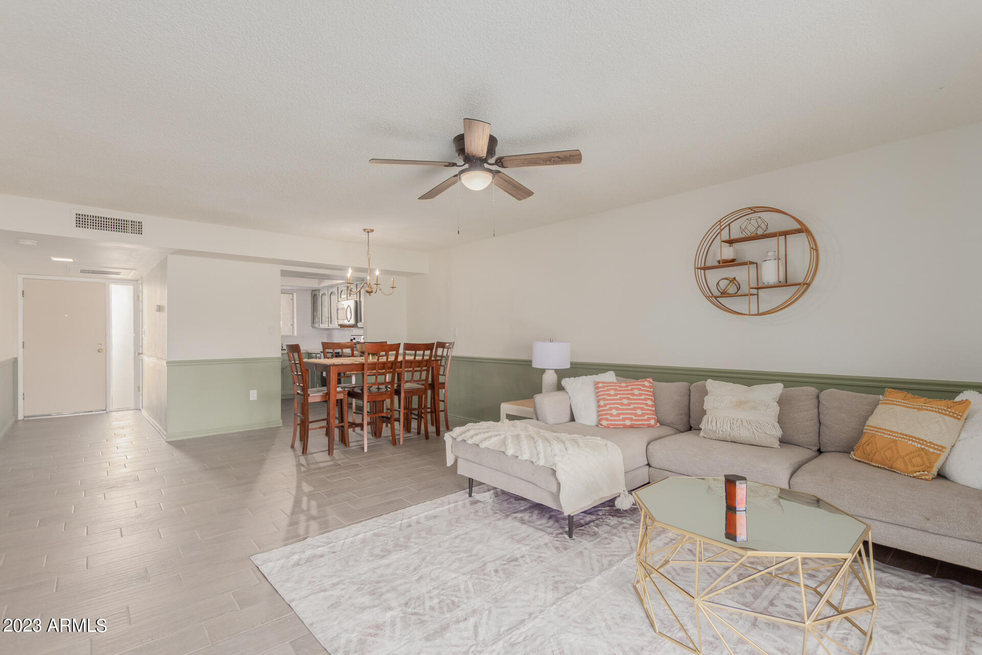 709 South Power Road, Unit 105 Mesa, AZ 85206 - Photo 5 of 36 a living room with furniture and kitchen view