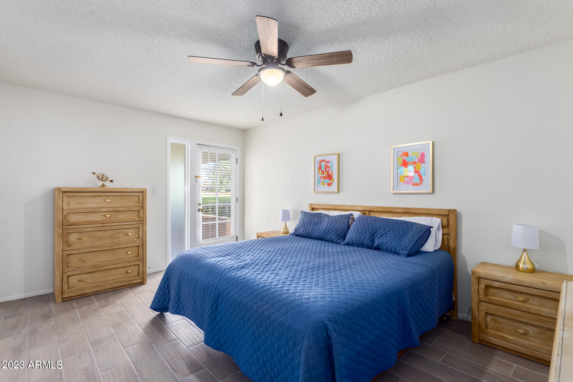 709 South Power Road, Unit 105 Mesa, AZ 85206 - Photo 10 of 36 a bedroom with a bed and a dresser