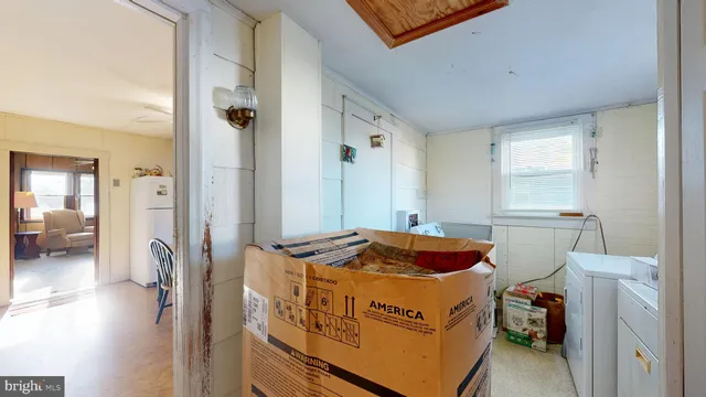 a bedroom with a bed and a mirror