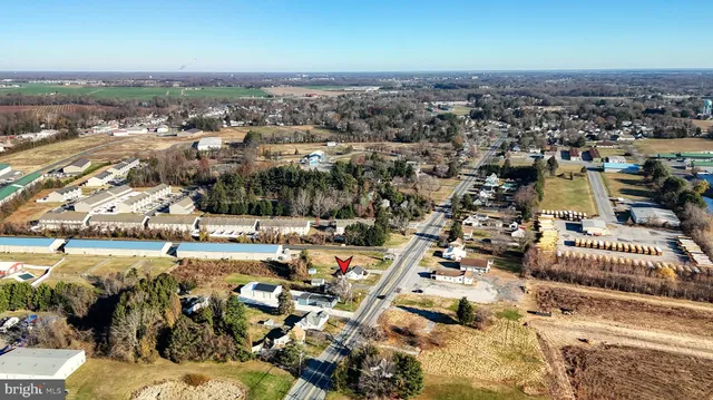 an aerial view of residential building with parking