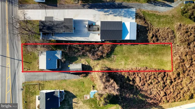 an aerial view of residential building and parking space