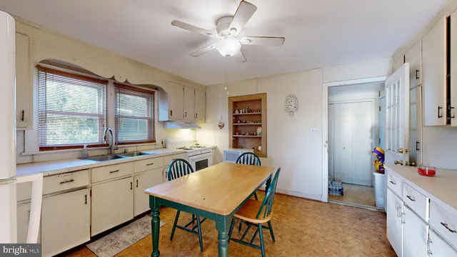 a kitchen that has a cabinets counter space appliances and a window