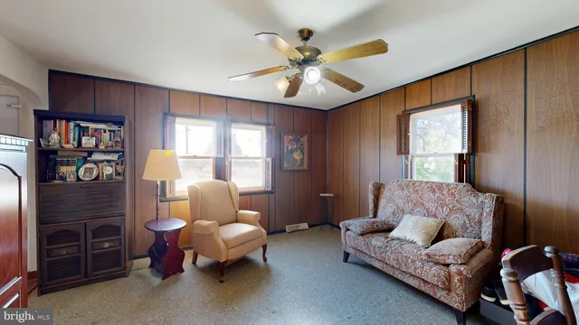 a living room with furniture and a window